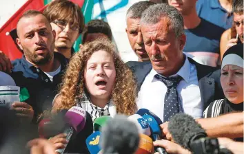  ?? AFP ?? Ahed Tamimi speaks to reporters upon her release from prison yesterday. Tamimi, who was 16 at the time of her detention, faced 12 charges, including aggravated assault.