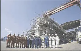  ??  ?? Department of Energy officials and members of the MP3 team proudly stand in front of the first offshore platform being built in the Philippine­s – made by Filipinos, for Filipinos