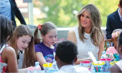  ?? — AP ?? WASHINGTON: First lady Melania Trump sits with a group of children to color and draw following a ribbon cutting ceremony and grand opening of the Bunny Mellon Healing garden at Children’s National Hospital in Washington on Friday, April 28, 2017. The...