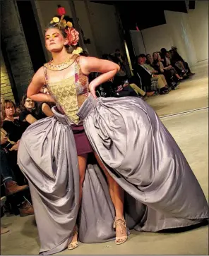  ??  ?? Ashley Little of Material Concepts introduced a full-length overskirt, complete with 18th-century panniers, draped around a mini dress.