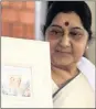  ??  ?? India’s Minister of External Affairs, Sushma Swaraj, with the joint commemorat­ive stamp of Pandit Deendayal Upadhyay and Oliver Tambo.