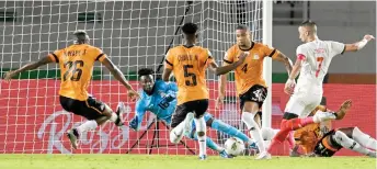  ?? — AFP photo ?? Morocco’s Hakim Ziyech (right) kicks to score during the match against Zambia.