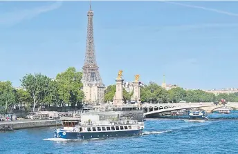  ?? — AFP photo ?? A peniche boat sails past the Eiffel Tower on the River Seine during a parade to test “maneuvers”, “distances”, “duration” and “video capture” of the future opening ceremony of the Paris Olympics in 2024.