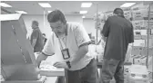  ??  ?? Ballots are processed Wednesday at the Maricopa County Tabulation and Election Center in Phoenix.