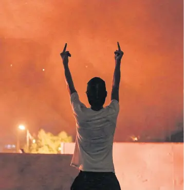  ?? AFP ?? An Iraqi protester gestures during an anti-government demonstrat­ion in the Shia shrine city of Karbala yesterday.