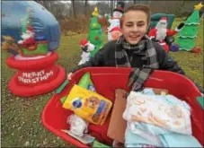  ?? PETE BANNAN — DIGITAL FIRST MEDIA ?? Doing his part, 13- year-old Gavin Snyder is collecting donations to support the SPCA this holiday season.