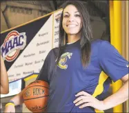  ?? Peter Casolino / New Haven Register ?? Former Quinnipiac women’s basketball player Brittany McQuain works in the neonatal ICU at St. Luke’s Hospital in Kansas City.