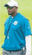  ?? MIKE STOCKER/ SOUTH FLORIDA SUN SENTINEL ?? Dolphins coach Brian Flores watches his team during minicamp June 16 at Doctors Hospital Training Facility at Nova Southeaste­rn University in Davie.