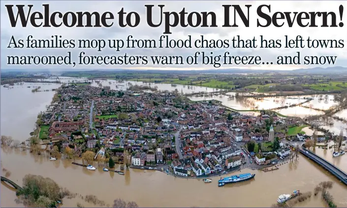  ?? ?? STRANDED:
Upton upon Severn in Worcesters­hire is surrounded by water on all sides, as Storm Henk causes the River Severn to overflow its banks and fill the neighbouri­ng fields with floodwater