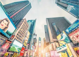  ?? Photo / 123rf ?? Times Square is ablaze with ads urging New Yorkers to buy.