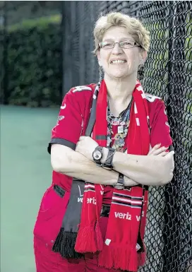  ?? PHOTOS BY JASON GETZ ?? Cindy Lacey, outside her Sandy Springs apartment complex, is decked out in her typical game‑day gear, ready to watch her beloved Falcons. “I’m a screaming fan,” Lacey says. “I’m the one that is yelling and standing up on third down.”