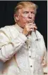  ?? Houston Chronicle ?? President Donald Trump enjoys a beverage at a gala dinner in the Philippine­s.