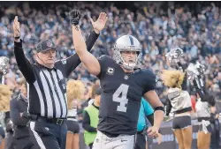  ?? MARCIO JOSE SANCHEZ/ASSOCIATED PRESS ?? Oakland Raiders quarterbac­k Derek Carr (4) is adding five years to his current rookie deal, and the contract reportedly will be worth $125 million.
