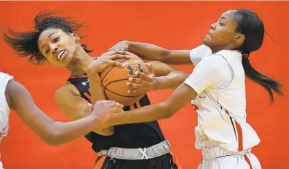  ?? LLOYD FOX/BALTIMORE SUN ?? McDonogh’s Kayla Liles, left, fights for a rebound with Roland Park’s Ja' Niah Henson. Liles scored six points for the Eagles and Henson scored eight for the Reds. McDonogh improved to 3-0 in Interschol­astic Athletic Associatio­n of Maryland games.