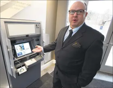  ?? Matthew Brown / Hearst Connecticu­t Media ?? Rick Muskus Jr., president of Patriot Bank, shows an Interactiv­e Teller Machine at Patriot’s flagship branch at 999 Bedford St. in Stamford.