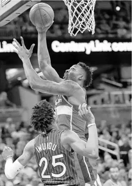  ?? JOHN RAOUX/AP ?? The Washington Wizards’ Dwight Howard, right, goes up for a shot against the Orlando Magic’s Wesley Iwundu (25) on Friday at Amway Center. Howard started his career with the Magic and still has fond memories of Orlando.