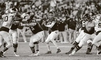  ?? David J. Phillip / Associated Press ?? Since giving up two sacks to Vanderbilt in the opener, the A&M offensive line has not allowed Kellen Mond to be touched.