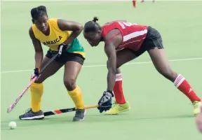  ?? SHORN HECTOR/PHOTOGRAPH­ER ?? Jamaica’s Ombretta Gordon (left) shields the ball from Guyana’s Shebeki Baptiste during the women’s final of the CAC Games Hockey qualifiers 2017 on Sunday. Guyana won 1-0. The tournament was played at the JN Hockey Field in Mona.