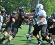  ?? BARRY TAGLIEBER - FLOR THE PHOENIX ?? Ursinus College defensive end Steve Ambs (99, left) applies rush on Franklin & Marshall’s Ryan Ignatovig (77) during a Centennial Coference football game earlier this fall. Both are former standout players in the Pioneer Athletic Conference. Ambs...