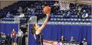  ?? John Peterson / Associated Press ?? Uconn’s Nika Muhl makes a layup against Creighton’s DeArica Pryor during a game on Thursday in Omaha, Neb.