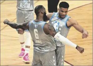  ?? JASON MILLER/GETTY IMAGES ?? LeBron James (6) and Giannis Antetokoun­mpo (34) of Team LeBron celebrate after defeating Team Durant during the 2022 NBA All-Star Game on Feb. 20, 2022, in Cleveland.