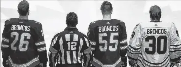  ?? CP PHOTO ?? Winnipeg Jets and the Chicago Blackhawks wore Broncos on the backs of their jerseys to honour the bus crash victims before their NHL game in Winnipeg on Saturday.