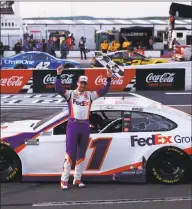  ?? Patrick Smith / Getty Images ?? Denny Hamlin celebrates after winning the Pocono 350 at Pocono Raceway last month in Long Pond, Pa.