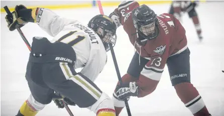  ?? JASON MALLOY ?? Charlottet­own Bulk Carriers Knights centre Brett Arsenault, left, prepares for a faceoff with Cole Burbidge, of the Mount Academy Saints, during the 2020-21 hockey season.