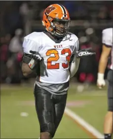  ?? RICH HUNDLEY III — FOR THE TRENTONIAN ?? Hamilton’s Tulo Adeaga (23) reacts after recording a sack against Hopewell Valley last Friday night.