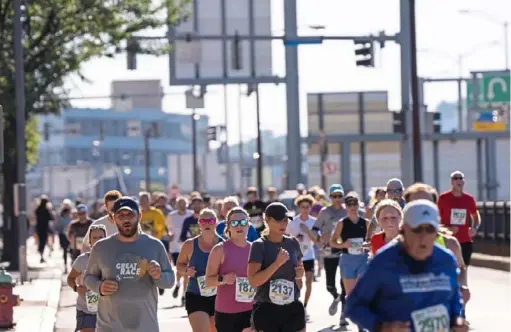  ?? Emily Matthews/Post-Gazette ?? Runners take part in the Richard S. Caliguiri City of Pittsburgh Great Race in 2021.