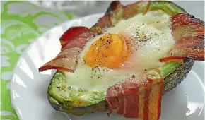  ??  ?? Avocado with egg and bacon – a ketogenic breakfast.