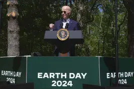  ?? MANUEL BALCE CENETA — THE ASSOCIATED PRESS ?? President Joe Biden speaks at Prince William Forest Park on Earth Day, Monday, April 22, 2024, in Triangle, Va. Biden is announcing $7 billion in federal grants to provide residentia­l solar projects serving low- and middle-income communitie­s and expanding his American Climate Corps green jobs training program.