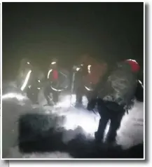  ?? Kerry Mountain Rescue vehicles on the December 26 call out and (above right) rescuers continue their search in blurry conditions. ??