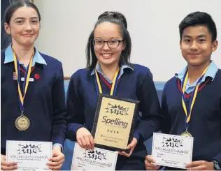  ?? PHOTOS: GRETA YEOMAN ?? Repeat success . . . Ashburton College team (from left) Ella Pearson (14), Chinatsu Hunt (13) and Marc Calzon (13) repeated their school’s 2017 success by winning the 2018 Otago Daily Times Extra! central South Island year 9 and 10 quiz last night.