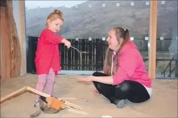  ?? 51_a03Cairndo­wChildcare­16 ?? The first official customer at the play area, two-and-a-half-year-old Connie MacDonald, has great fun with her mum Lizzie Clark.