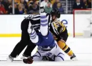  ?? WINSLOW TOWNSON/THE ASSOCIATED PRESS ?? Michel Cormier tries to break up Brad Marchand and James van Riemsdyk. Marchand got the last laugh, with an empty-net goal.