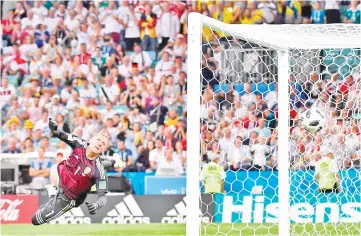  ??  ?? Sweden’s goalkeeper Robin Olsen watchs Germany’s midfielder Toni Kroos’ free kick go in during the Russia 2018 World Cup Group F football match between Germany and Sweden at the Fisht Stadium in Sochi on June 23, 2018. - AFP photo