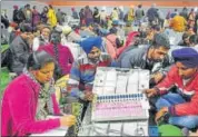  ?? HT FILE ?? Poll officials inspect an EVM machine in Punjab.