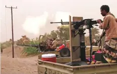  ?? AFP ?? Yemeni pro-government forces fire a heavy machine gun in Hodeida. Government troops have launched a multiprong­ed attack on Hodeida and its port.