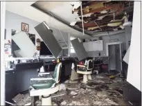  ?? ?? Major fire damage can be seen inside Belltown Barbers in Stamford on Wednesday.