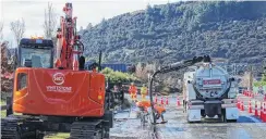  ?? PHOTOS: KERRIE WATERWORTH ?? Pump first, dig later . . . Contractor­s pump out the last of the floodwater­s on Aubrey Rd, Wanaka.