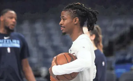  ?? STU BOYD II/THE COMMERCIAL APPEAL ?? Memphis Grizzlies’ guard Ja Morant watches teammates shoot the ball during a practice with the team on Dec. 15 at the Fedex Forum in Downtown on Memphis.