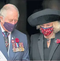  ??  ?? Above: The Prince of Wales and Duchess of Cornwall attend a private, televised service at Westminste­r Abbey, marking the centenary of the burial of the Unknown Warrior. Right: A member of the armed services gives a salute at the Cenotaph on Whitehall, marking 100 years since the inaugurati­on of the permanent memorial.