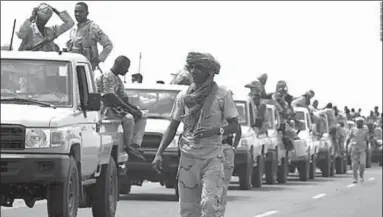  ??  ?? Sudanese forces fighting alongside the Saudi-led coalition in Yemen gather near the outskirts of the western port city of Hodeidah, Yemen. (Photo: CNN)