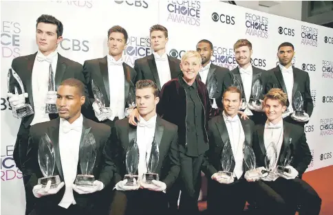  ??  ?? DeGeneres poses backstage with men holding awards at the People’s Choice Awards 2017 in Los Angeles, California, US, on Wednesday. — Reuters photo