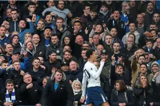  ??  ?? Foul: Spurs forward Dele Alli’s goal celebratio­n in front of Chelsea fans