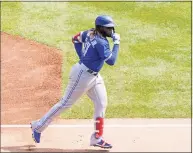  ?? Kathy Willens / Associated Press ?? The Blue Jays’ Vladimir Guerrero Jr. gestures as he runs the basepaths after hitting a home run against the Yankees on Sunday.