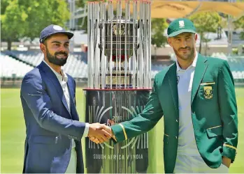  ?? — BCCI ?? Virat Kohli ( left) and Faf du Plessis pose with the Freedom Trophy ahead of the India- South Africa Test series.