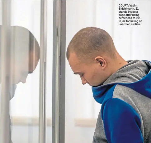  ?? ?? COURT: Vadim Shishimari­n, 21, stands inside a cage after being sentenced to life in jail for killing an unarmed civilian.