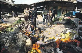  ?? AFP ?? The aftermath of a car bomb attack on a market in the northern Syrian city of Afrin yesterday. At least eight people, four of them civilians, were killed in the explosion